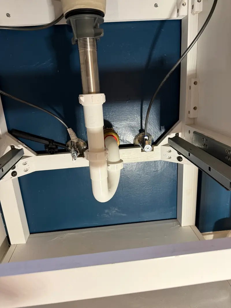 Under-sink P-trap and drain assembly repair in Boring, Oregon — drain cleaning and plumbing repair by Bigfoot Plumbing licensed plumber