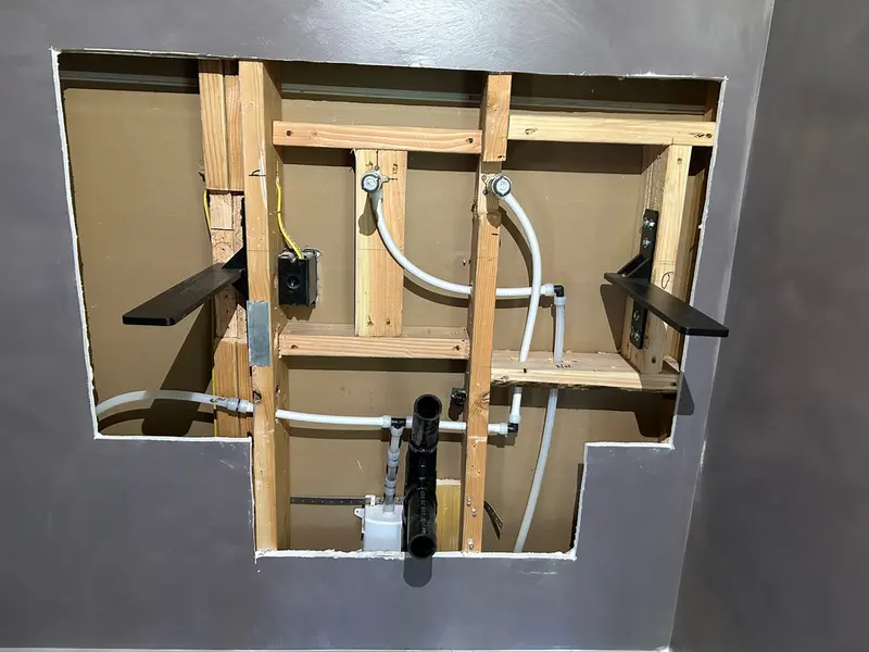 Wall-mounted vanity PEX rough-in plumbing for bathroom remodel in Sandy, Oregon — repipe and fixture rough-in by Bigfoot Plumbing