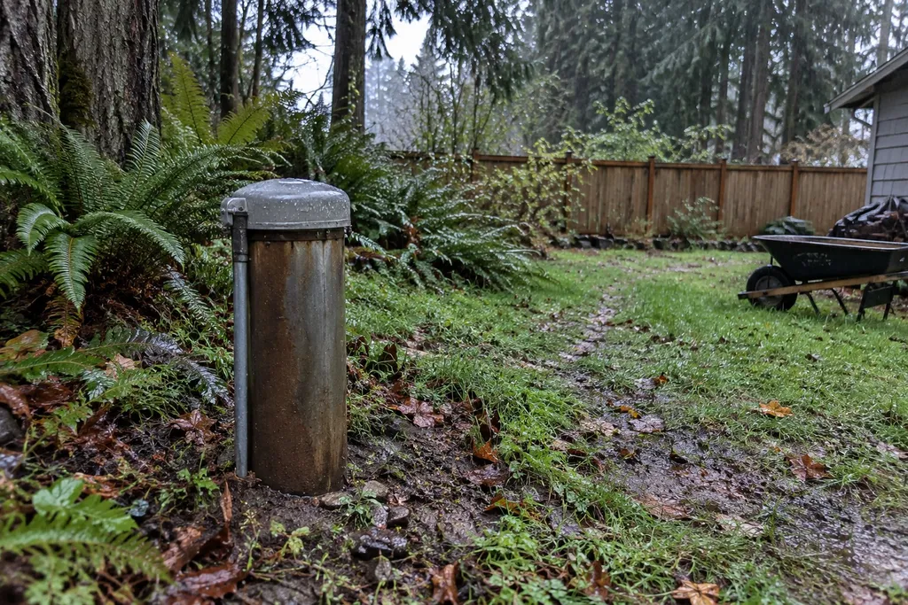 Private well casing in a wet backyard near Troutdale, Oregon